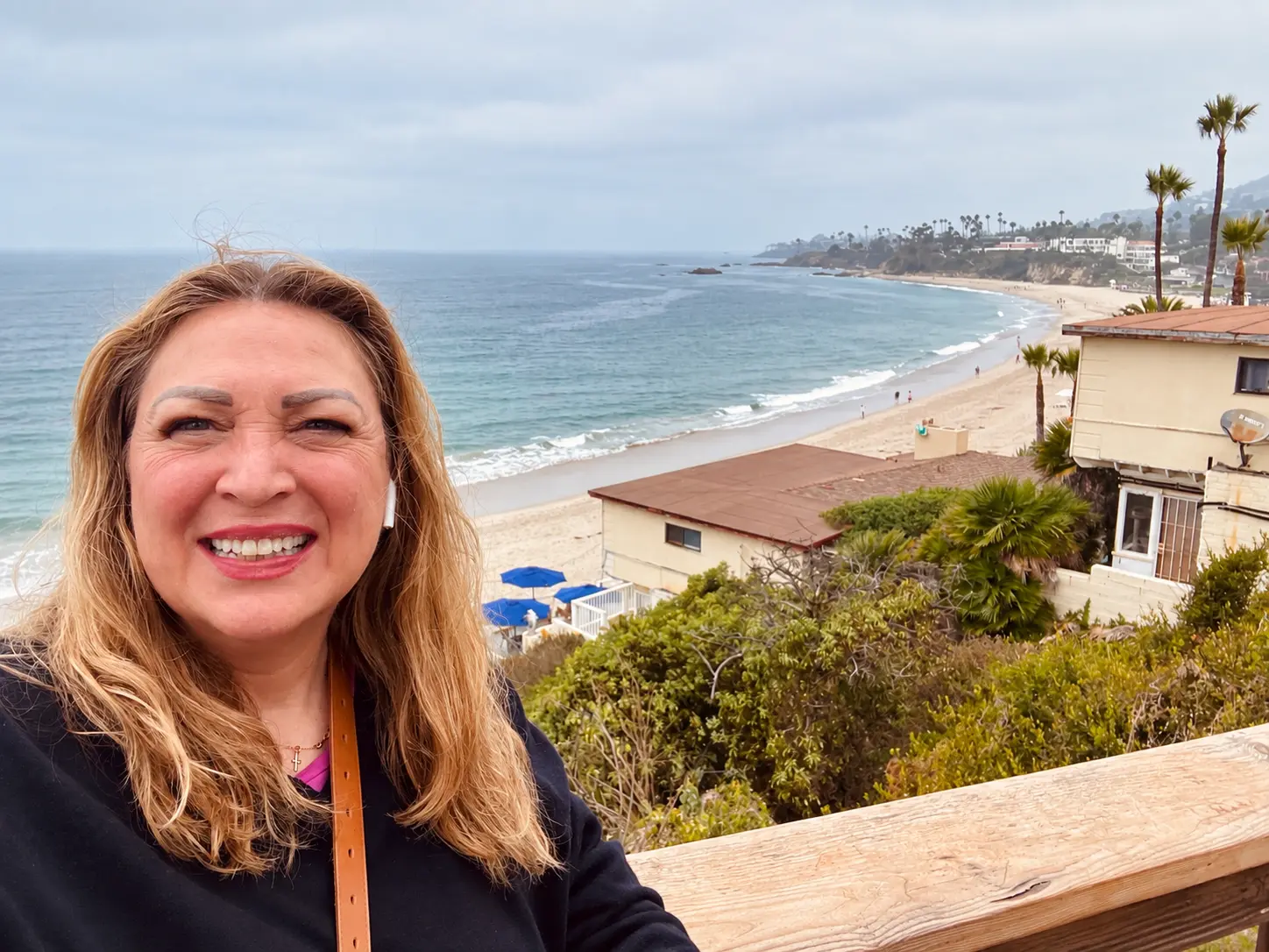 Phalynn smiling at a beach overlook